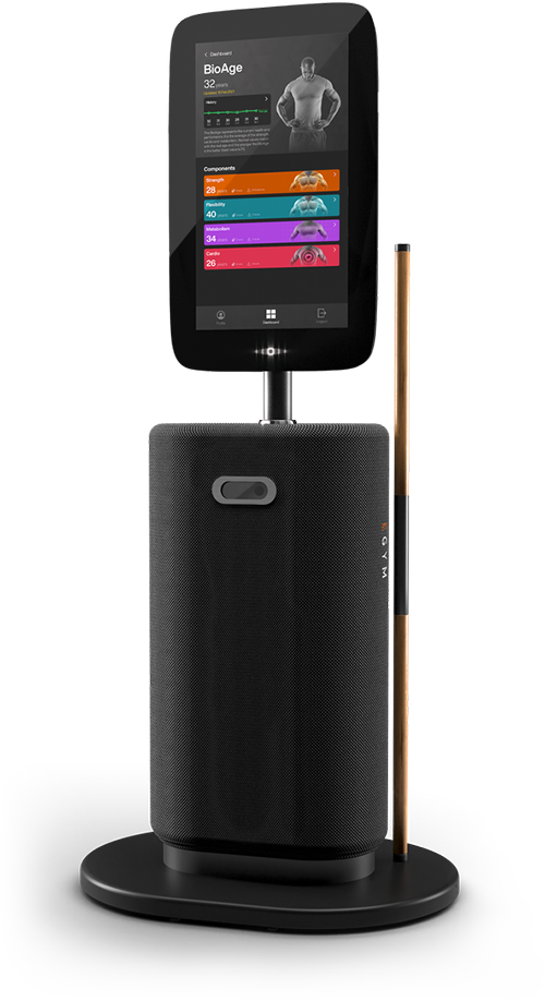 Ein elegantes, modernes Fitnessgerät mit einem großen vertikalen Touchscreen, der Fitnessdaten anzeigt, darunter „BioAge“ und verschiedene farbige Messwerte. Der Touchscreen ist auf einem zylindrischen, schwarzen Lautsprecher-ähnlichen Sockel montiert, das Ganze befindet sich auf einer kreisförmigen Plattform.